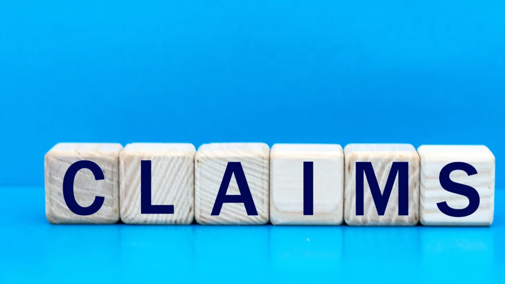 Blocks spelling the word CLAIM on a blue background, representing the concept of claiming a page on Facebook